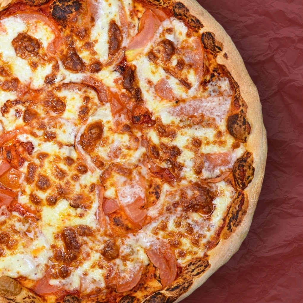 The Classic pizza at CrustyCraft Pizza Transcona, Winnipeg - mozzarella, prosciutto cotto, tomatoes and mushrooms on tomato base