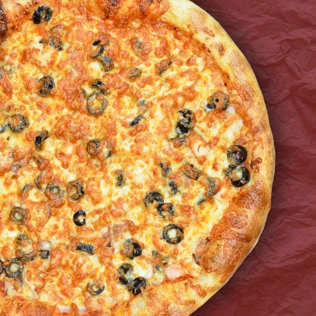 Meat Lovers pizza at CrustyCraft Pizza Transcona, Winnipeg - hand-rolled European-style pizza loaded with premium meats